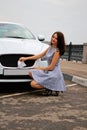 Cute brunette and luxury car Royalty Free Stock Photo