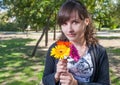 Cute brunette women with bouquet of flowers in her hands