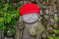 Cute Buddha statue with victory hand sign at Nanzoin, Fukuoka