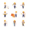 Cute Builders Set, Little Boys and Girls in Hard Hats and Blue Overalls Working with Construction Tools Cartoon Style Royalty Free Stock Photo