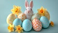 Cute Bunny with Pastel Easter Eggs and Daffodil Flowers, Holiday Spring Festive Celebration on Blue Royalty Free Stock Photo