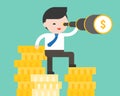 cute business man standing on stack of gold coins, using binoculars, vision advantage of having more budget concept