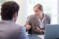 Cute businesswoman receiving a customer