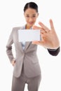 A cute businesswoman showing a blank business card Royalty Free Stock Photo