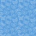 Cute butterfly pattern. Blue seamless background with white doodle flying insects. Monochrome print. Vector repeat illustration Royalty Free Stock Photo