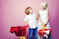 Cute buyer customer client hold shopping cart. Buy with discount. Girl and boy children shopping. Couple kids hold Royalty Free Stock Photo