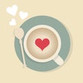 Cute cappuccino cup with red heart and a teaspoon from top view