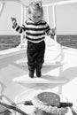 Cute and carefree. Adventure boy sailor travelling sea. Child cute sailor on yacht sunny day. Boy adorable sailor