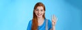 Cute carefree redhead female shopping, show four fingers, number fourth smiling lucky upbeat, amused positive expression Royalty Free Stock Photo