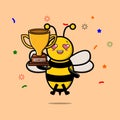 Cute Cartoon of bee holding up the golden trophy Royalty Free Stock Photo