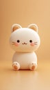 Cute Cartoon Cat Toy Sitting on a Beige Surface Royalty Free Stock Photo