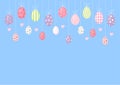 Cute cartoon colorful Easter eggs hanging - blue background