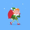 Cute cartoon elf walking and carries a bag or sack with Christmas gifts. Christmas funny character. Santa Claus helper. Elfish boy