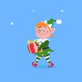 Cute cartoon elf walking and carries Christmas gift box. Christmas funny character. Santa Claus helper. Elfish boy. Isolated on bl