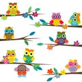 Cute cartoon owls on tree branch