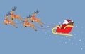 Cute cartoon Santa Claus flying on a sleigh with reindeers isolated on blue background Royalty Free Stock Photo