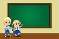 Cute cartoon school girl and boy in uniform with backpacks near clean chalkboard. Royalty Free Stock Photo