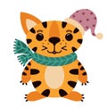 Cute cartoon striped tiger. The animal is standing and smiling. A predator in a New Year\'s red cap and green scarf. Royalty Free Stock Photo