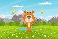 Cute cartoon tiger stands on the field against the background of mountains and sky. Summer landscape. The symbol of the year. Royalty Free Stock Photo