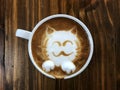 Cute cat face latte art coffee in white cup Royalty Free Stock Photo