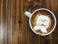 Cute cat face latte art coffee in white cup Royalty Free Stock Photo