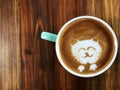 Cute cat face latte art coffee in white cup Royalty Free Stock Photo