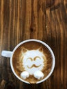 Cute cat face latte art coffee in white cup Royalty Free Stock Photo