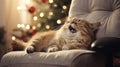 Cute cat lying on modern armchair and yawning on background of stylish decorated christmas tree in sunny room. Pet and winter