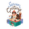 Cute cat sitting on pile of christmas giftbox. Holiday card with funny kitten in party cap wrapped in garland. Season