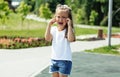 Cute caucasian baby, little girl crying on the playground in the park. Sad emotion of a child Royalty Free Stock Photo