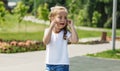 Cute caucasian baby, little girl crying on the playground in the park. Sad emotion of a child Royalty Free Stock Photo