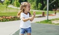 Cute caucasian baby, little girl crying on the playground in the park. Sad emotion of a child Royalty Free Stock Photo