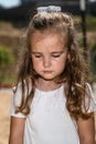 Cute caucasian baby, little girl crying on the playground in the park. Sad emotion of a child Royalty Free Stock Photo