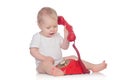 Cute caucasian baby playing with telephone