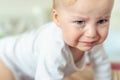 Cute caucasian blond toddler boy portrait crying at home during hysterics. Little child feeling sad. Little actor acting sadness Royalty Free Stock Photo