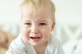 Cute caucasian blond toddler boy portrait crying at home during hysterics. Little child feeling sad. Little actor acting sadness