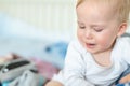 Cute caucasian blond toddler boy portrait crying at home during hysterics. Little child feeling sad. Little actor acting sadness Royalty Free Stock Photo