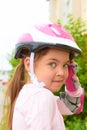 A cute Caucasian child wearing a helmet and roller guard Royalty Free Stock Photo