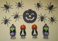 Cute characters in monster costume. Scary Halloween figurines stand on a light background close-up Royalty Free Stock Photo