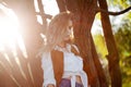 Cute charming girl in summer in the field. Young woman is happy and feels free outdoors Royalty Free Stock Photo