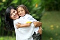 Cute cheerful child with mother