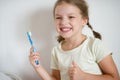 Cute cheerful girl cleans a teeth. Royalty Free Stock Photo