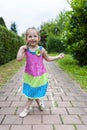 Cute cheerful little girl playing hopscotch on playground outside Royalty Free Stock Photo