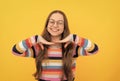 cute cheerful schoolgirl nerd child in eyeglasses for vision, face portrait