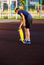 Cute cheerful smiling Boy in blue t shirt sneakers riding on yellow skateboard. Active urban lifestyle of youth, training, hobby Royalty Free Stock Photo