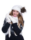 Cute cheerful teenage girl posing in the studio. Showing emotions. Wearing knitted woolen sweater, scarf, hat and mittens. Royalty Free Stock Photo