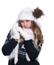 Cute cheerful teenage girl posing in the studio. Showing emotions. Wearing knitted woolen sweater, scarf, hat and mittens. Royalty Free Stock Photo