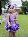 Cute cheerleader in violet bug costume.