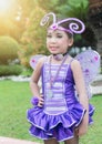 Cute cheerleader in violet bug costume.
