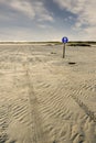 Direction sign on a beach